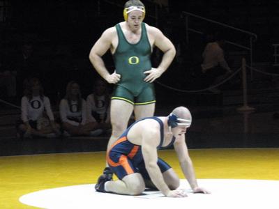 Senior Chris Dearmon (standing), got a pin against the Vikings to finish out the regular season