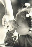 Child holding hand of adult