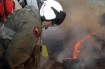 U.S. Navy Chief Aviation Electronics Technician Rexford Sackett looks down on miles of burnt terrain in San Diego