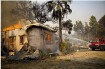 Firefighters from the Carlsbad Fire Brigade battle the flames near Escondido, California. Photo courtesy: Talia Frenkel/American Red Cross