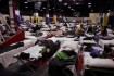 San Diego County residents take refuge in the Sports Warehouse Gym on Naval Air Station North Island, Calif.