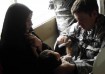 A U.S. Army medic examines an Iraqi child DoD photo