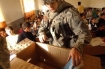 U.S. soldier gives out school supplies to kids