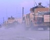 American HUMVEE`s kick up dust at Camp Phoenix in Kabul, Afghanistan
