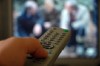 TV remote control held in a hand