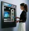 Woman using ATM