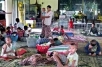 Displaced residents who lost their homes take shelter in a Buddhist temple in Rangoon on May 5th 2008.