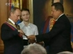 Putin and Chavez with a ceremonial sword