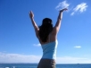 woman raising arms