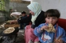 A Palestinian child eats home-made bread in the southern Gaza town of Rafah