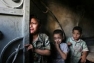 Palestinian children cower in fear during Israeli military offensive in Gaza