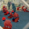 Image of men bound and imprisoned at Guantanamo.