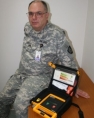 Oregon Guardsman Richard Powell helped two fellow soldiers save a man's life 2-13-08 with the automated external defibrillator.