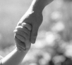 Child and parent holding hands
