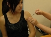 Teenager receiving HPV vaccine during Vaccination Week in the Americas