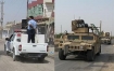 Iraqi Police, left, now escort U.S. troops on missions.  Photos in al Dujal