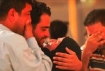 Recently freed Iraqi prisoner is greeted by family members