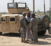 A soldier and an interpreter meet with an Iraqi sheik to discuss local activity in his tribal area. Photo by Tim King Salem-News.com
