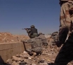 Iraqi army soldiers from 2nd Brigade, 2nd Iraqi Army Military Iraqi and U.S. Army soldiers react to small arms fire during a joint battlefield circulation patrol a few days ago in Mosul, Iraq.