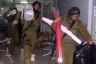 Israeli soldiers looting a sewing workshop in Hebron