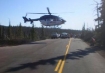 Helicopter landing on Highway 242