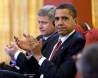 The President speaks to a worker making wind towers.