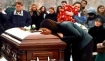 Alexis Witt at husband`s coffin