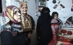 An interpreter and family members stand with Areej in their home; situated in a part of Gaza worst hit by Israel's white phosphorus bombs, a blatant war crime as yet unpunished.