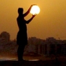 Man holding sun