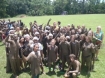 Rolleston with students after muddy game of Tug-of-War