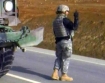 American soldier from the Oregon National Guard during a Convoy flat tire change on an Afghanistan highway.