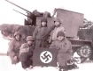 U.S. soldiers in the Battle of the Bulge with a captured Nazi battle flag.