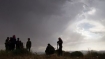 Syrian armed groups take position near Qusayr, 15 km from the city of Homs, on May 10, 2012.