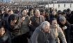 North Koreans cry, over the death of their leader Kim Jung Il, in front of the Statue of the Sun in Pyongyang