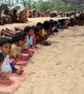 Kids from Dhinkia, Gadkujang, Govindpur and Nuagaon villages “illegally” lay down on the hot earth under in the blazing summer heat and refused to move to allow entry to government officials. 