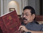 President Mahinda Rajapaksa studying the report of the Lessons Learnt and Reconciliation Commission, at his residence in Colombo on November 29, 2011. 