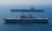 Republic of Korea Ship (ROKS) Dokdo (LPH 6111) steams alongside USS George Washington (CVN 73) in the Sea of Japan during operation âInvincible Spirit.