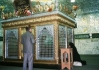 A Pakistani Muslim pays his respects beside the sarcophagus enclosure of Hujr ibn Adi al-Kindi in February 2011. (Photo by Yuram Abdullah Weiler)