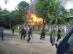 File photo of government forces in a burning Sittwe village