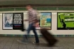 A commuter walks past an anti-Muslim poster in New York's Times Square subway station. A federal judge ruled that the advertisement is protected speech under the First Amendment of the US Constitution.