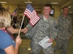 U.S. soldier welcomed off the plane from Iraq