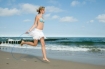 Woman jumping rope on beach