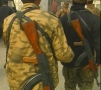 Mongolian soldier in Afghanistan carries the AK47 rifle.