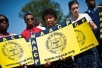 Members of the NAACP hold signs in front of the US Supreme Court in Washington on June 25, 2013 (AFP, Nicholas Kamm)