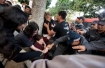 Israeli policemen beat and arrest women at a demonstration held by the feminist movement New Profile