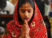 A Pakistani Christian girl prays as she attends a Christmas service. 