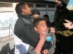 Israeli forces detain a child in Hebron, March 20. (MaanImages/B'Tselem, HO)