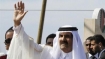 Emir of Qatar Sheikh Hamad bin Khalifa Al Thani waves to the crowd as he arrives in the Gaza Strip on October 23, 2012.