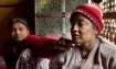 Raduan, left, helps her ailing mother Noor Jahan to steady her weak body at their living room in The' Chaung village in north of Sittwe, Rakhine state