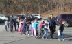 Children are led from Sandy Hook Elementary School in Newtown, Conn., on Friday after a reported shooting there.   Shannon Hicks / The Newtown Bee. 